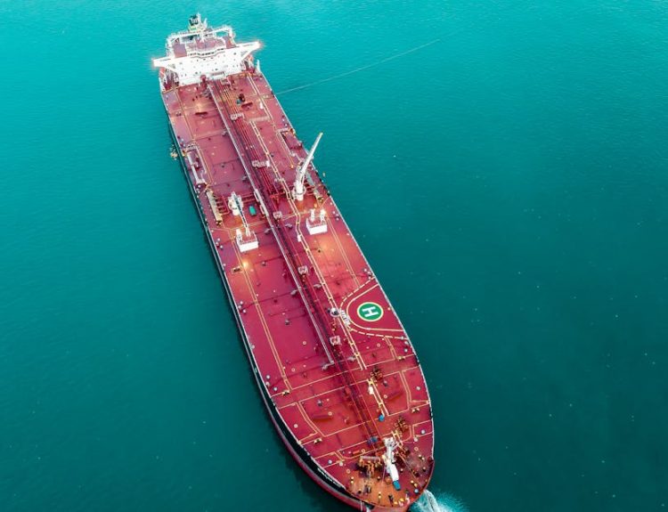 Aerial shot of an oil tanker cruising through the ocean, emphasizing maritime transport.