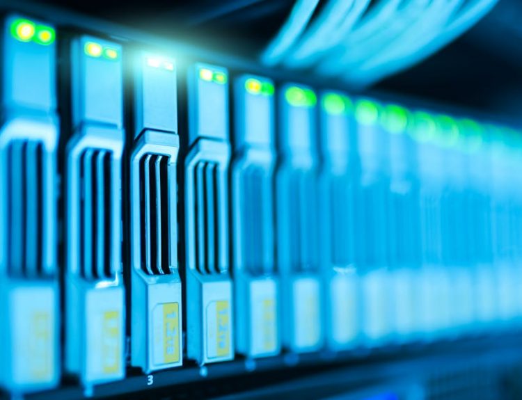 Detailed image of a server rack with glowing lights in a modern data center.