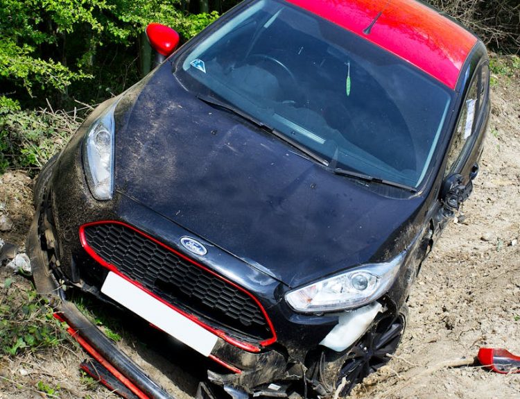 Damaged car after an accident on a dirt road in Welwyn Garden City, UK.