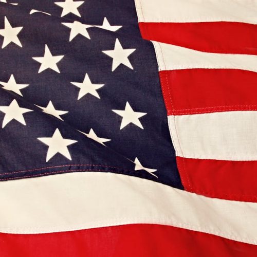 Detailed image of the American flag showcasing the stars and stripes symbolizing USA's patriotism and pride.