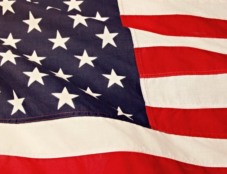 Detailed image of the American flag showcasing the stars and stripes symbolizing USA's patriotism and pride.