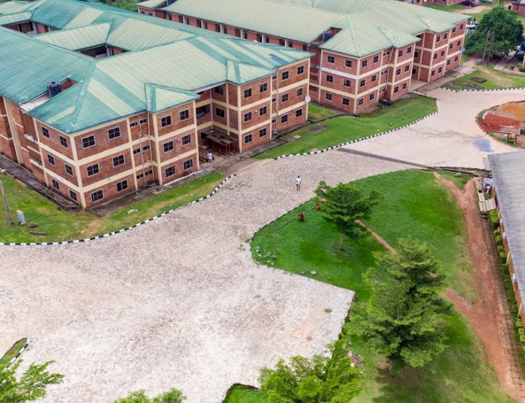 Aerial shot of a university campus in Ota, Nigeria, showcasing modern educational architecture.