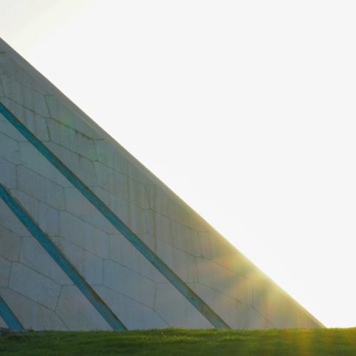 The Azadi Tower in Tehran captured with the sunrise illuminating its iconic architecture.