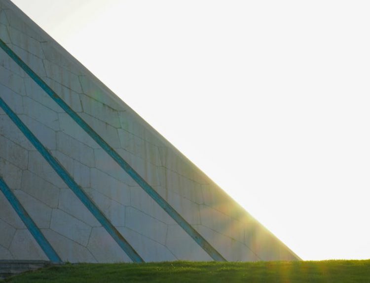 The Azadi Tower in Tehran captured with the sunrise illuminating its iconic architecture.