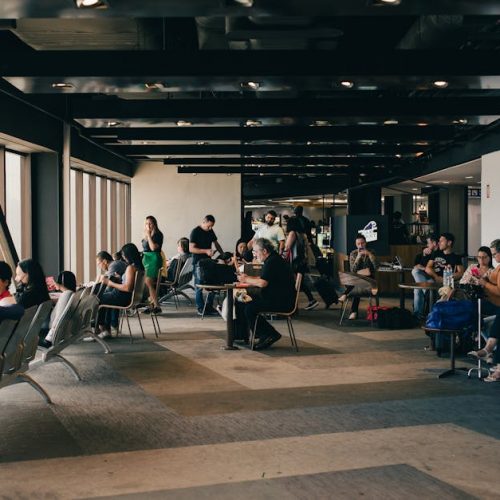 Passengers relaxing in a São Paulo airport waiting area, capturing a travel moment.