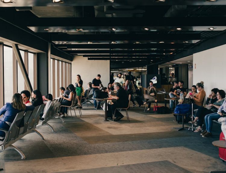 Passengers relaxing in a São Paulo airport waiting area, capturing a travel moment.