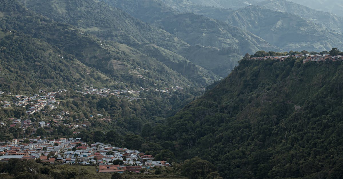 A captivating aerial view of the mountainous landscape in Mérida, Venezuela, showcasing lush greenery and a picturesque town.