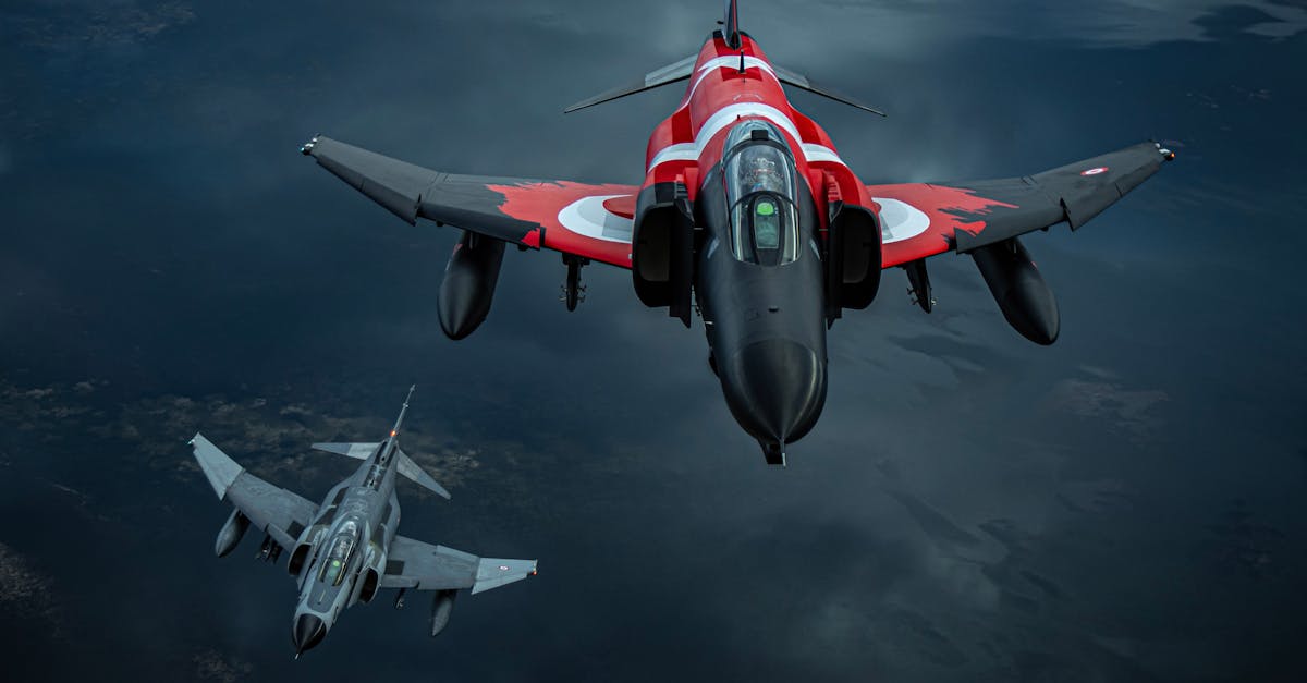 Three jet fighters soar through the sky in a dramatic aerial formation, showcasing their power.