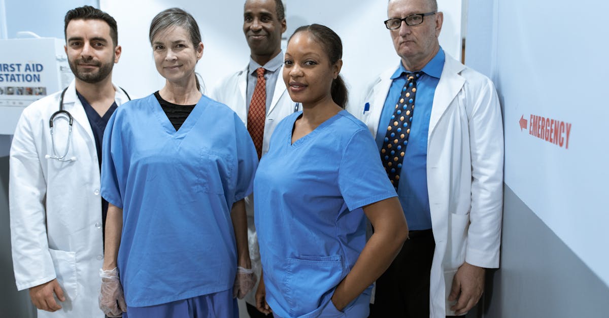 A diverse group of healthcare professionals in hospital uniforms, showcasing teamwork and diversity.