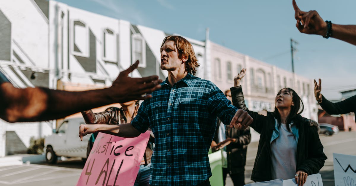 Vibrant street protest scene with diverse group holding justice signs. Encourages change.