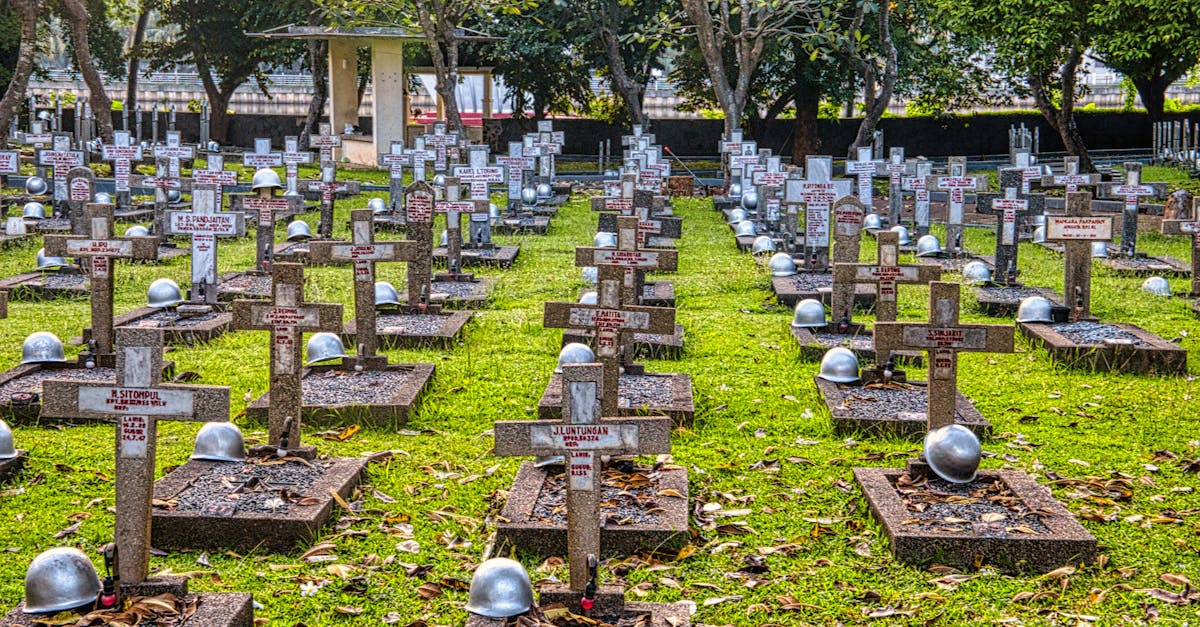 A serene view of a military cemetery in Jakarta featuring cross headstones and lush greenery.