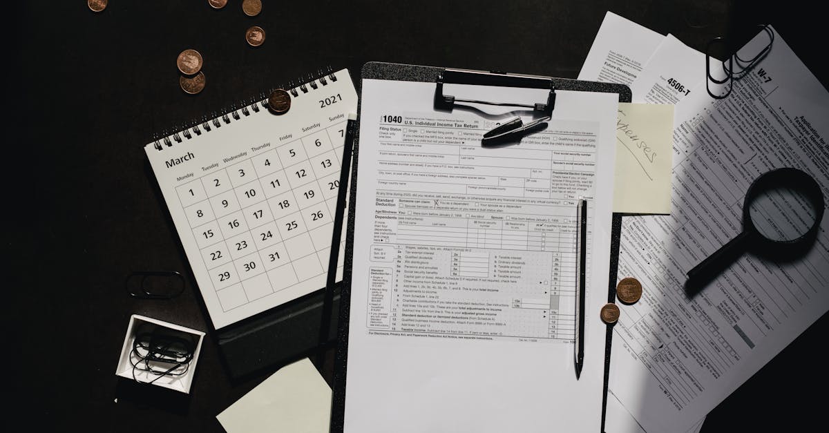 A neatly organized workspace featuring tax forms, calendar, magnifying glass, and office supplies for efficient tax preparation.
