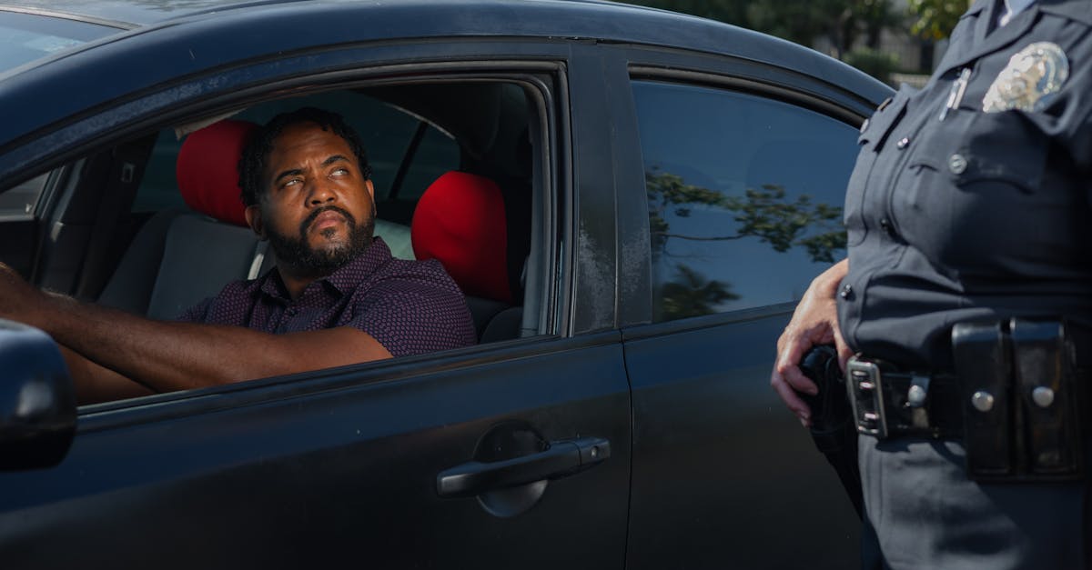 A driver receives a traffic ticket from a police officer for a speeding violation.