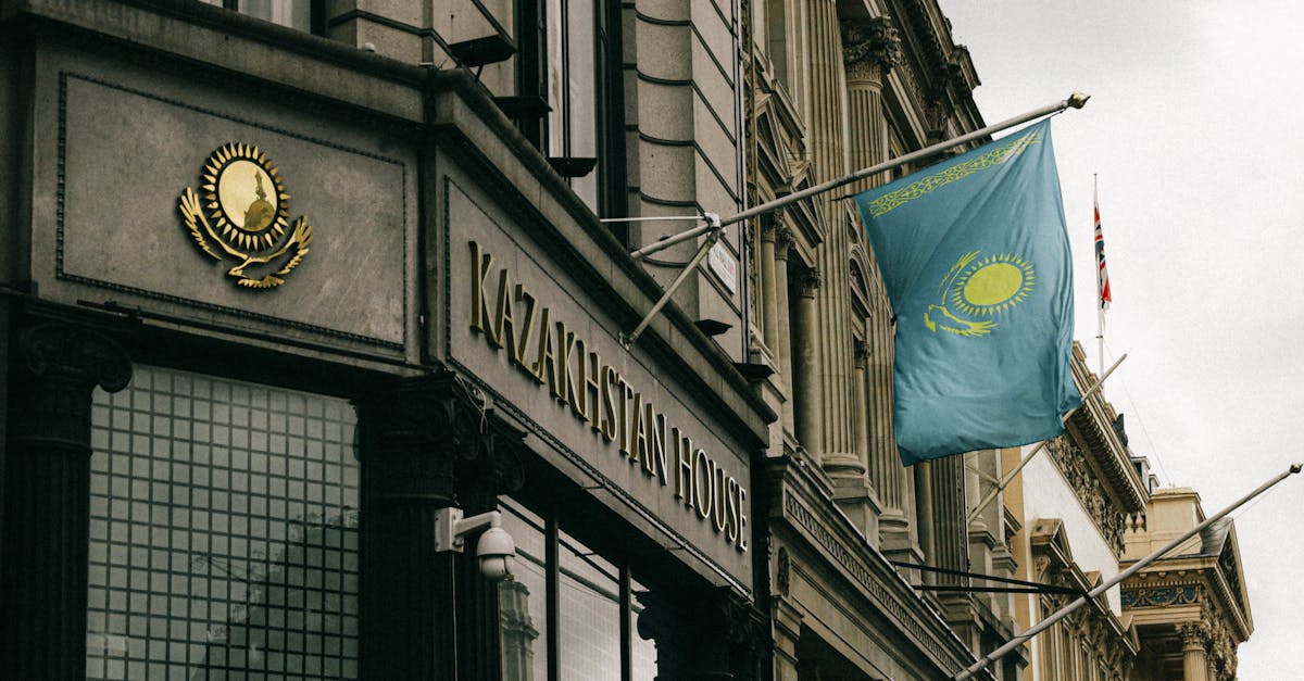 Kazakhstan House facade with flag and emblem in London, showcasing diplomacy and architecture.