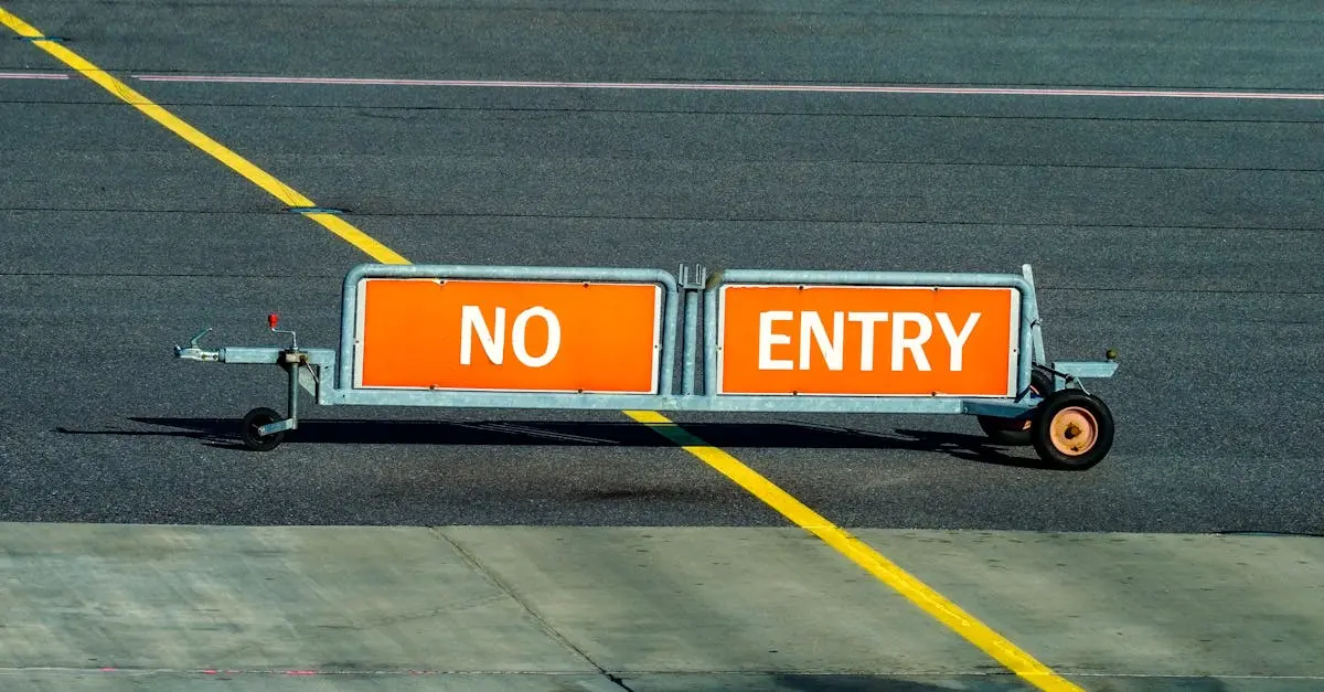 A warning sign indicating no entry on an airport taxiway with a bold yellow line.